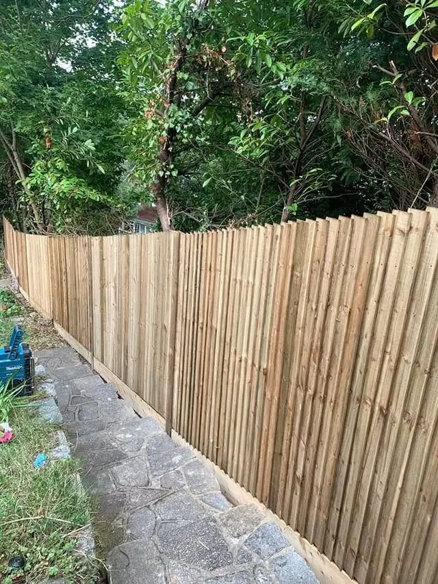 New featheredge closeboard fence along a side path